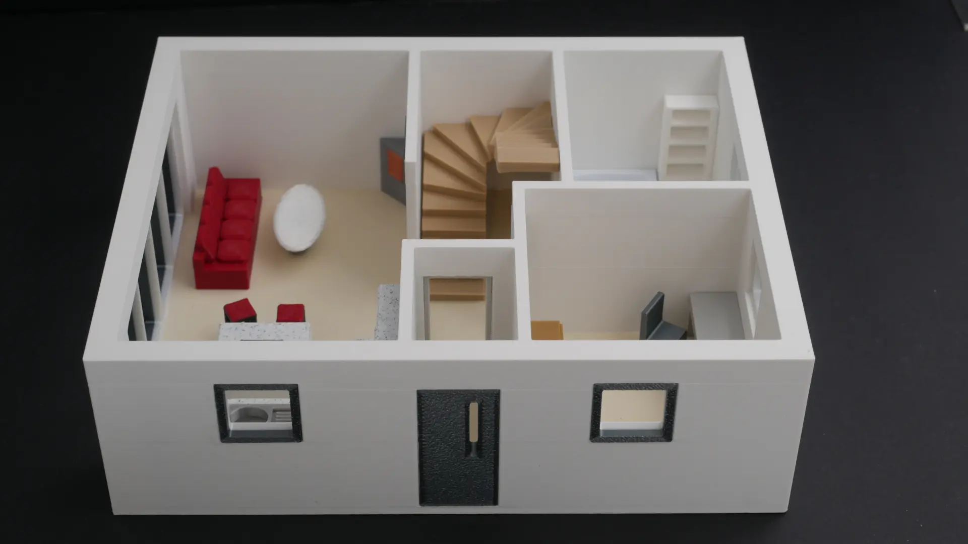 3D-gedrucktes Grundrissmodell des Erdgeschosses mit Wohnbereich, Treppe und Fassade